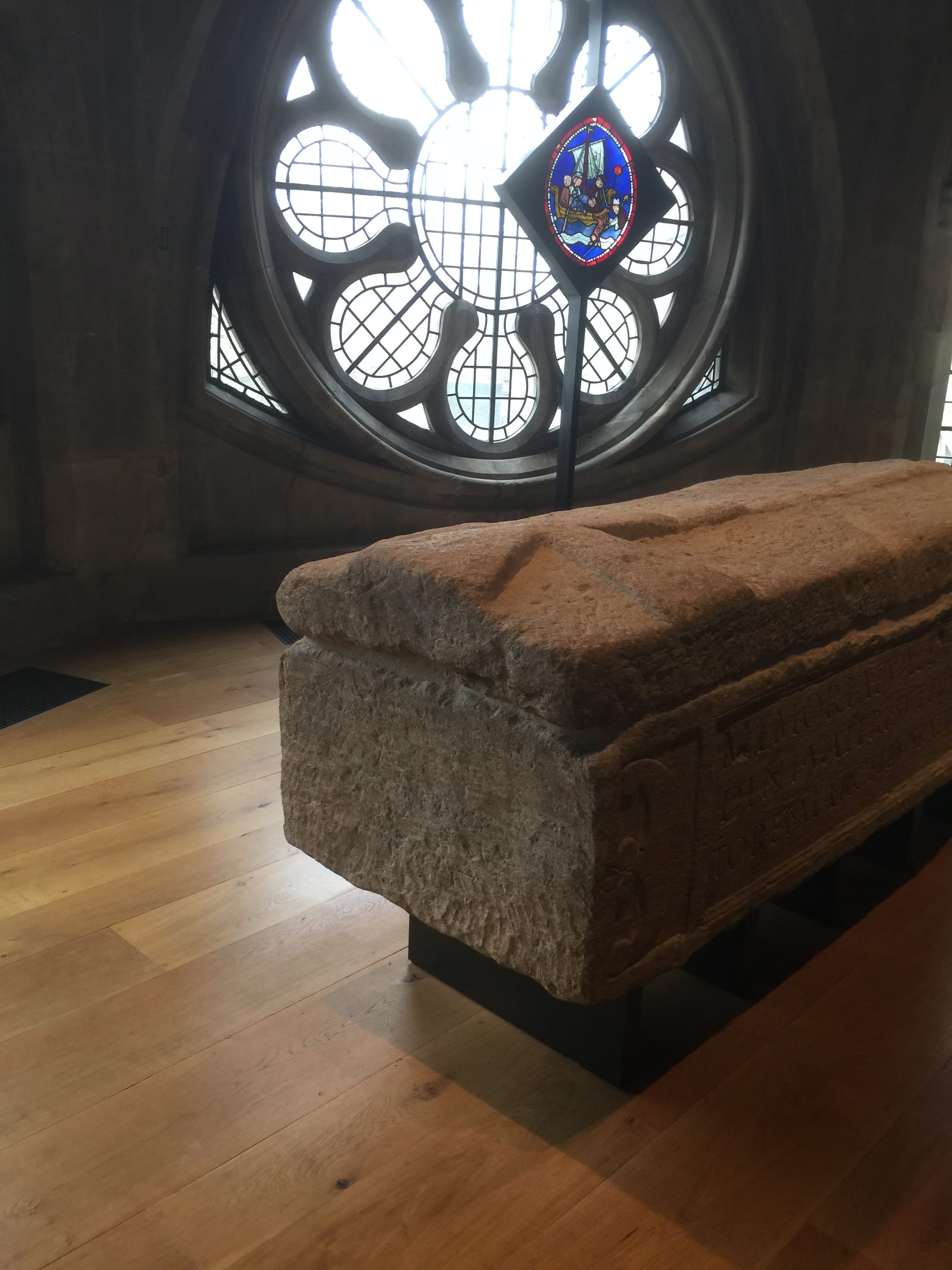 The sarcophagus, with the cross carved on its lid.