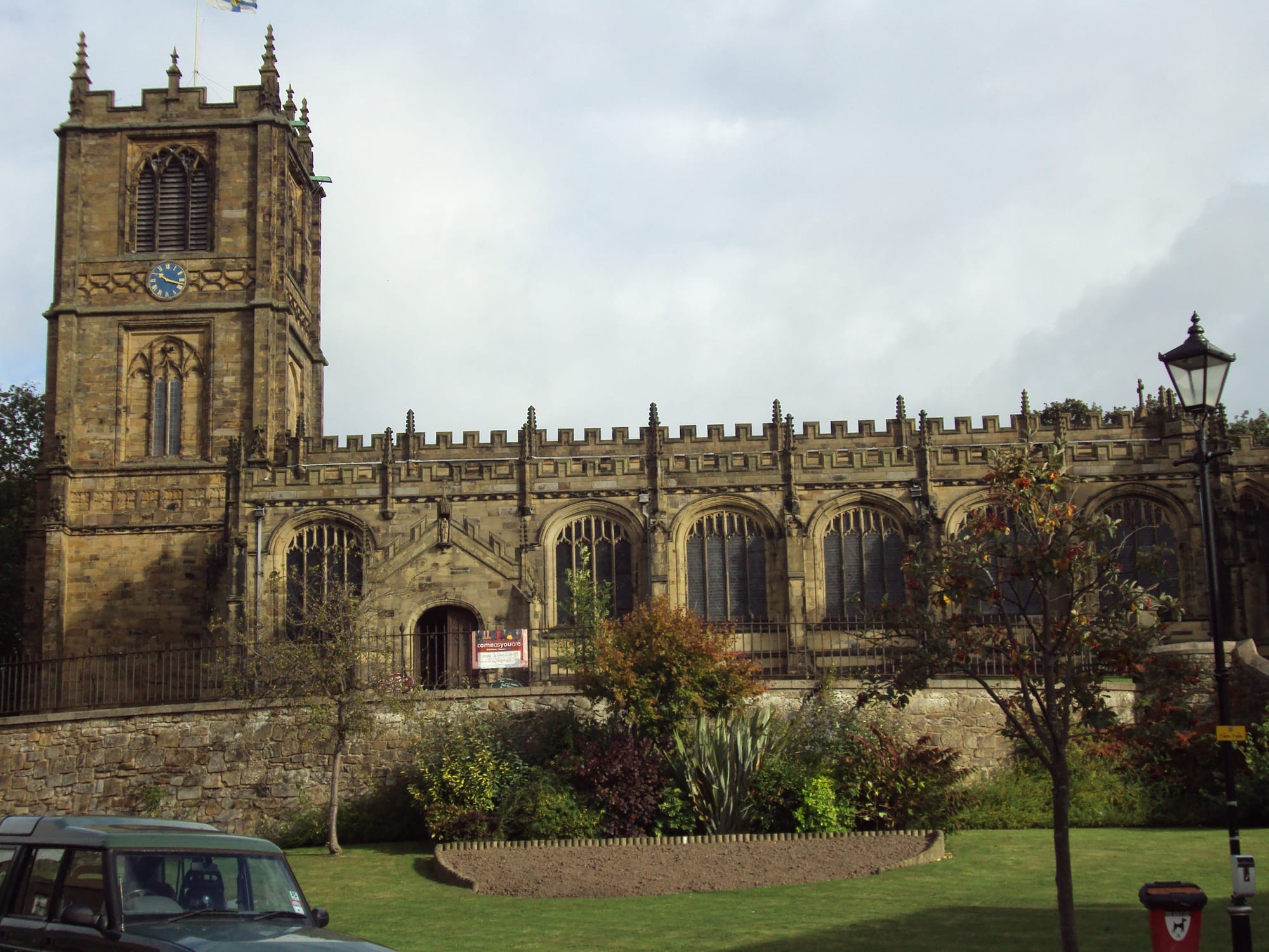 Mold High Street in Flintshire, Wales, with St Mary's Church in view
