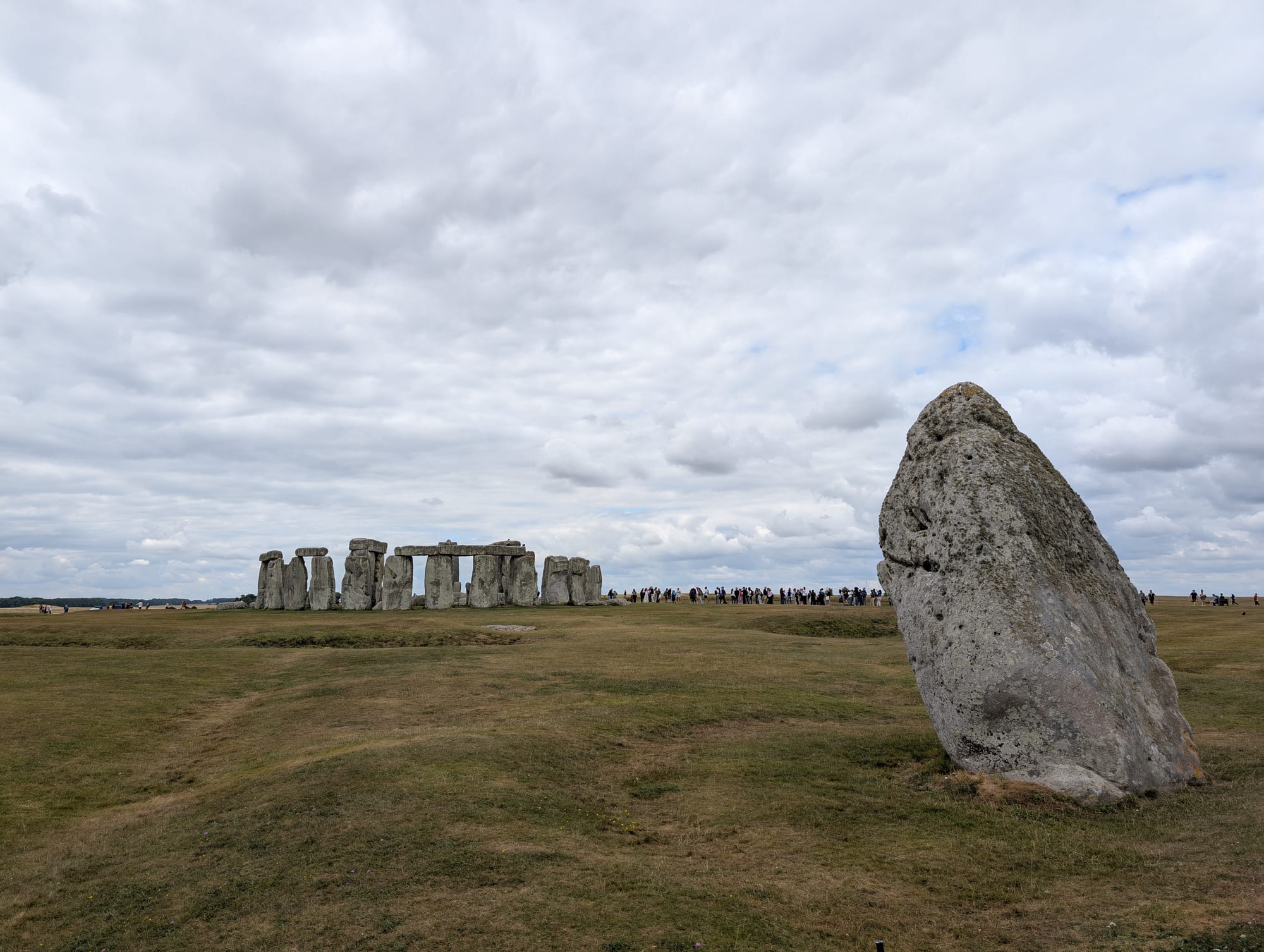 the Heel Stone at Stonehenge with the main stone circle behind it